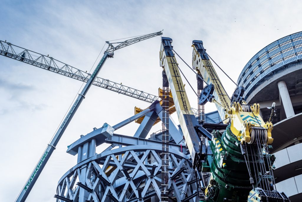 Madrid, Spain - July 12, 2020: Cranes in use in Santiago Bernabeu Stadium redevelopment work