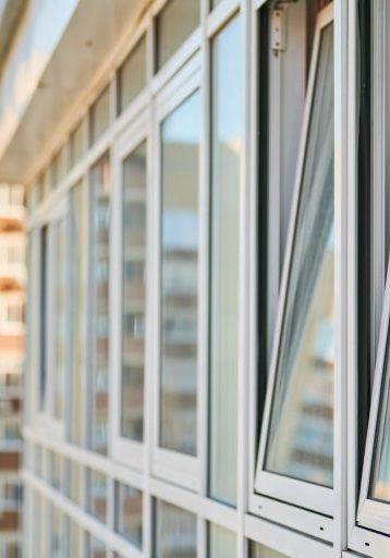PVC windows on facade of skyscraper. Plastic double glazed windows. Building exterior.